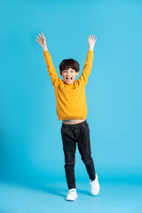 full body image of asian boy posing on blue background