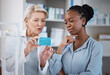 © Wesley JvR/peopleimages.com - Healthcare, help and black woman with medicine from a pharmacist, dosage information and recommendation. Medical, sick and doctor reading label on a box of pills with an African patient for medicare