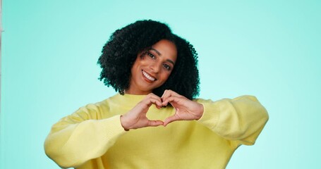 Canvas Print - Heart, hands and portrait of black woman in studio, background and color backdrop. Happy female model with finger shape for love, thank you and smile in support of peace, emoji and care for kindness