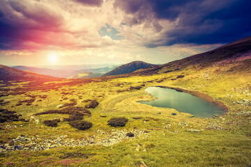 Affiche - Picturesque mountains and a small lake illuminated by evening light. Carpathian mountains, Ukraine, Europe.