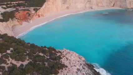 Wall Mural - Aerial view of beautiful empty beach in Greece, no people. Dramatic coastline scenic bay rocky cliffs in the Ionian island, Port Katsiki, Lefkada. Blue turquoise waving sea.