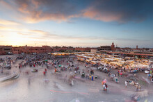 Jemaa Al Fna Square With Crowds And Food Stalls At Sunset. Marrakesh, Morocco.