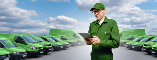 Poster - Manager with a digital tablet on the background of vans. Fleet management	
