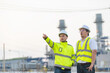 © reewungjunerr - Group Asian man petrochemical engineer working at oil and gas refinery plant industry factory,The people worker man engineer work control at power plant energy industry manufacturing