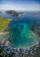 El Nido, Palawan, Philippines. Sunrise Light with Boats on Water.