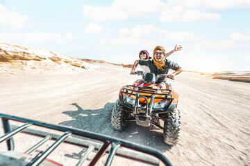 young couple on a off road adventure excursion outside - joyful tourists enjoying weekend activity o