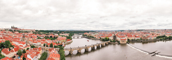 Prague Old Town in Czech Republic with Famous Sightseeing Places in Background. Charles Bridge Iconic 14th century Structure with View, Vltava river and Prague Cityscape. Must Visit City