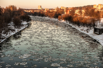 Wall Mural - River Neris and Cold Winter Day with Ice in Water and Snow.