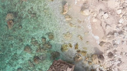 Wall Mural - Aerial view of beautiful empty beach in Greece, no people. Dramatic coastline scenic bay rocky cliffs in the Ionian island, Port Katsiki, Lefkada. Blue turquoise waving sea.