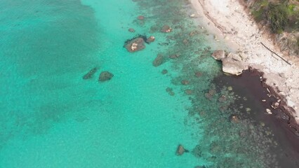 Wall Mural - Aerial view of beautiful empty beach in Greece, no people. Dramatic coastline scenic bay rocky cliffs in the Ionian island, Port Katsiki, Lefkada. Blue turquoise waving sea.