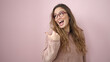 © Krakenimages.com - Young beautiful hispanic woman smiling confident pointing with finger to the side over isolated pink background