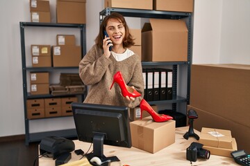 Sticker - Young caucasian woman ecommerce business worker talking on the smartphone at office