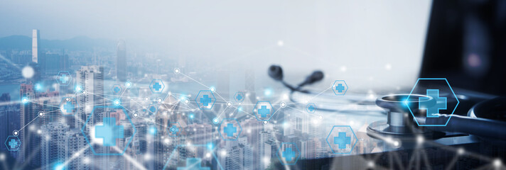 Telemedicine, internet medical network connection, online medical, global health concept. Stethoscope and laptop computer on the city background with internet health network connection technology