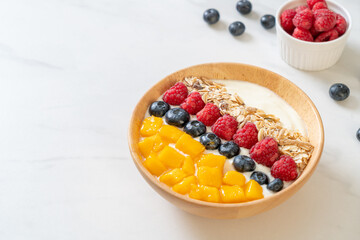 Wall Mural - homemade yogurt bowl with raspberry, blueberry, mango and granola