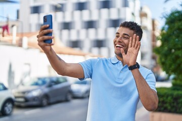 Poster - African american man smiling confident having video call at street