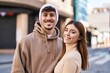 © Krakenimages.com - Mand and woman couple smiling confident standing together at street