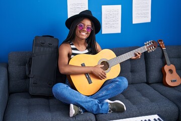 Poster - African american woman musician playing classical guitar at music studio