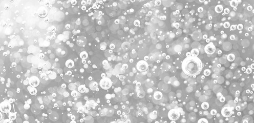 Wall Mural - Bubbles underwater in bright light. Background of oxygen bubbles in black and white tones with bokeh