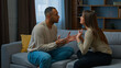 © Yuliia - Family conflict couple quarrel annoyed 30s african american man arguing with angry hispanic woman ethnic husband wife talking indoors shouting disagreement problem relationship breakup marriage crisis