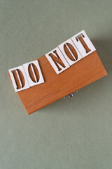 Poster - do not on a wooden box