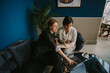 © qunica.com - Showing something on the laptop