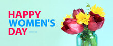 Happy Women's Day. March 8. Bright Bouquet Of Tulips And Yellow Flowers On A Blue Background. Flowers In A Jar, Side View. Flowers And Congratulatory Text.