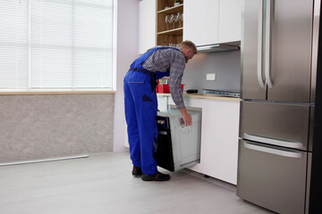 Wall Mural - Oven Repair Technician. Appliance Maintenance Service