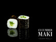 Close up to Maki sushi roll pieces with mirror reflection on black background. Sushi roll with cucumber and nori seaweed on top. Ready menu advertising banner with text and copy space.
