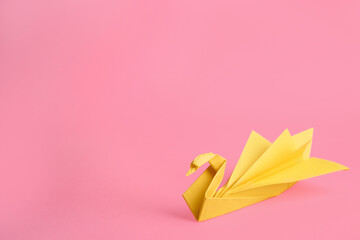 Sticker - Origami art. Beautiful paper swan on pink background, space for text