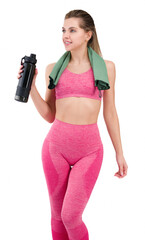 Wall Mural - Fitness woman with athletic figure holding water or drink in her hand and a towel around her neck.Fit woman in pink sportswear isolated on white background showing her figure and smiling. In a pink