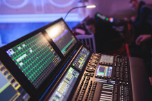 View Of Lighting Technician Operator Working On Mixing Console Workplace During Live Event Concert On Stage Show Broadcast, Light Mixer Controller Panel, Sound Technician With Professional Equipment