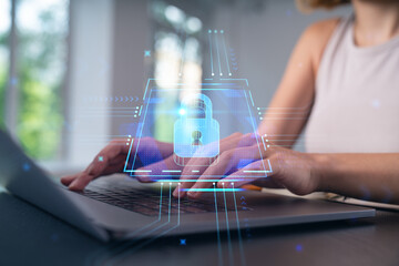 Woman typing on laptop at office workplace in background. Concept of working process, internet surfing, online business education. Student send e-mail. Close up view. Padlock icons