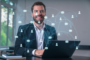 Wall Mural - smiling businessman in formal wear working on laptop at office workplace with smartphone and noteboo