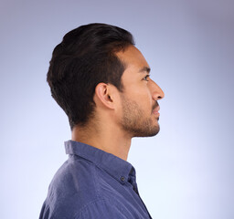 Wall Mural - Profile, head and thinking with a man in studio on a gray background looking thoughtful or contemplative. Idea, side and face with a handsome young male contemplating a thought on a color wall