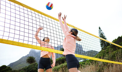 Canvas Print - Volleyball, beach and spike with sports women playing a game outdoor for training or competition. Team, sport and ball with female friends on the sand by the coast to play a competitive match