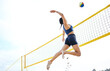 Volleyball, sports and woman jump at beach to hit ball in competition, game or match. Training, exercise and female athlete jumping for spike in tournament for workout, fitness and health at seashore