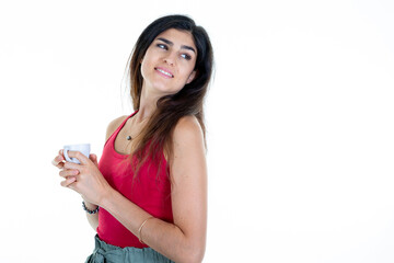 Wall Mural - cute happy young woman with white cup of coffee aside copy space looking back behind white background