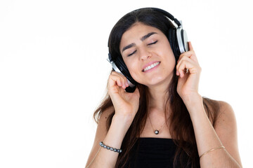 Wall Mural - cheerful young woman smiling closed eye dream listen music song at headphones