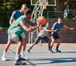 © Irshaad Majal/peopleimages.com - Basketball, game and fitness men team exercise with sport teamwork and athlete training. Outdoor basketball court with sports workout and wellness cardio of people in urban competition collaboration