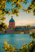 Toulouse, France. Beautiful Cityscape With The River Garonne And La Grave Dome In The Background At Sunset