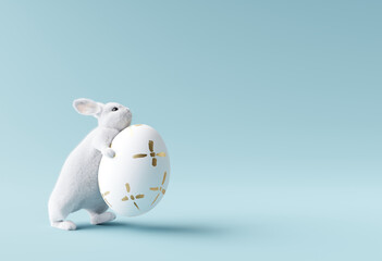 bunny holding easter egg on pastel blue background. 3d rendering