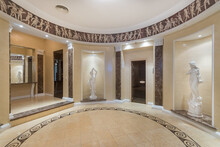 Round Lobby Wellness Spa Center, Decorated In Greek Style With Painted Walls And Statues In Niches.
