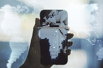 Wall Mural - double exposure of abstract digital world map and hand with cell phone on background, research and s