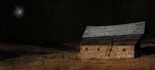 Wall Mural - old stable with a bright star overhead