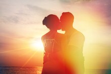 Silhouette Sunset : Senior Business Man And His Wife Hugging And Kissing On Celebration Event At The Yacht Deck,Silhouette Romance Scene Marriage Anniversary Over Sunset, Luxury And Happiness Moment
