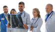 © ty - Group of doctors checking x-rays in a hospital.
