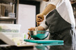 © dsheremeta - Close up. A male cook prepares pancake batter in a metal bowl in the kitchen of a restaurant.