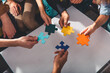 © alphaspirit - Teamwork of partners connect puzzle pieces as integration and startup