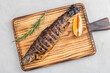 Grilled mackerel on a cutting board