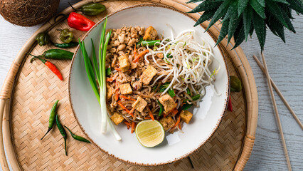 Sticker - Udon noodles stir fry with chicken, carrots, onions, lime, green sprouts and nuts.